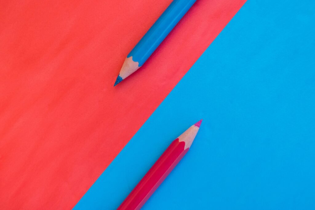 pexels-photo-17151677-17151677 A vibrant and minimalistic composition with red and blue pencils on contrasting backgrounds.